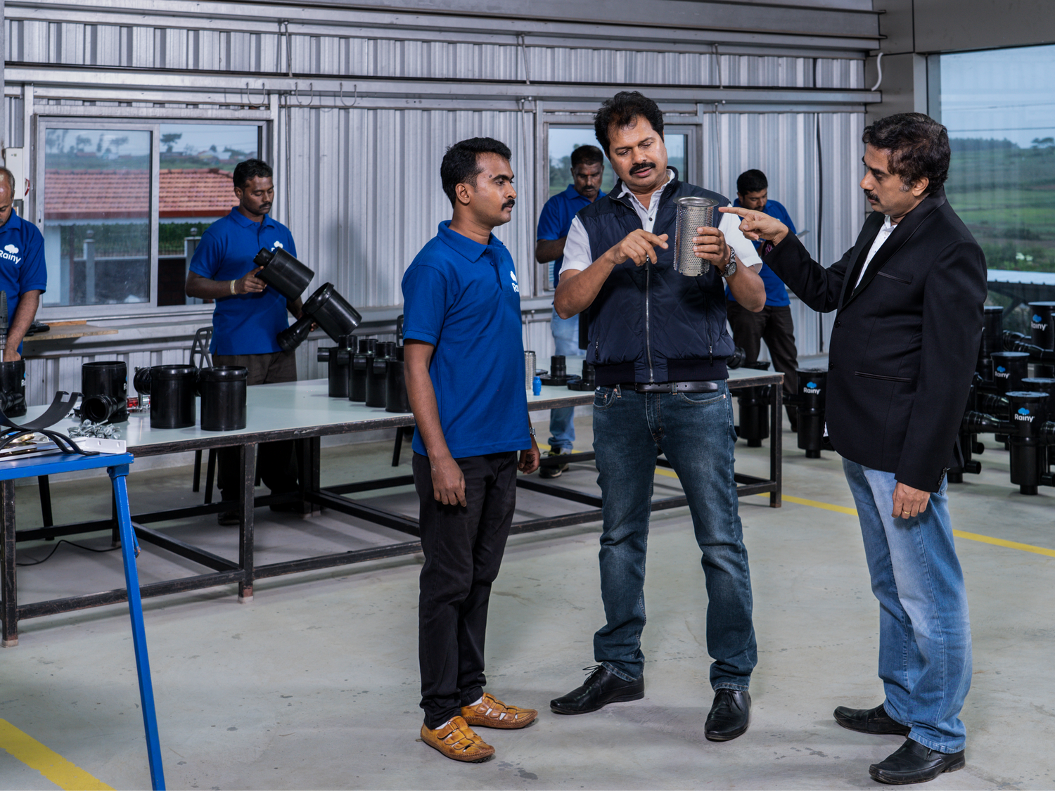 Rainwater Filter System Discussion with Workers at Rainy Filters for Improved Efficiency